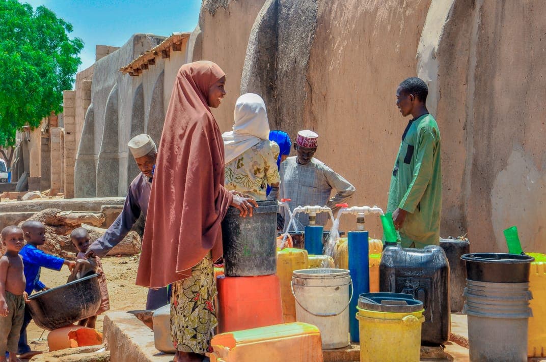 Turawa community members fetching from the new solar borehole