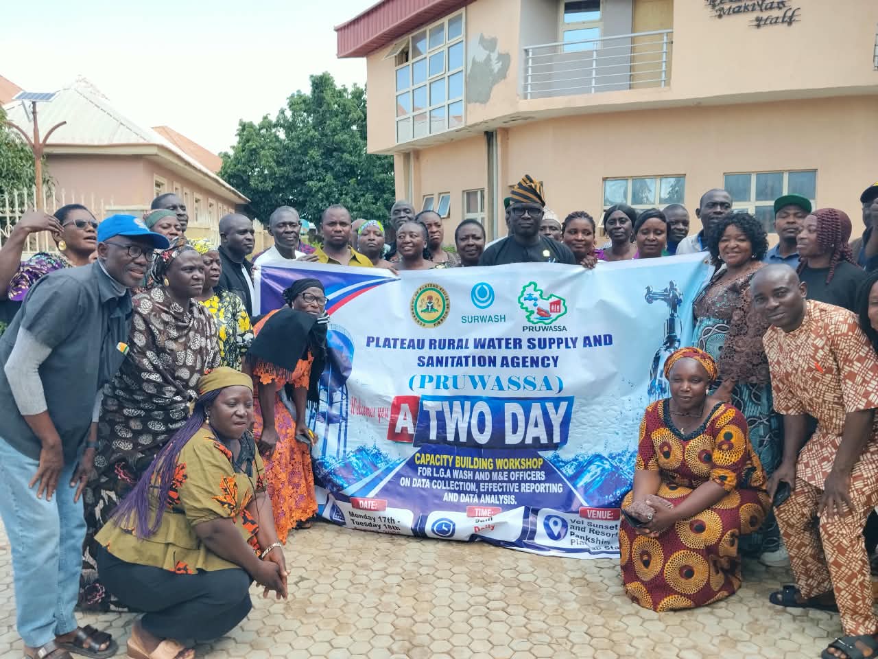 PRUWASSA staff pose after a WASH data training workshop.