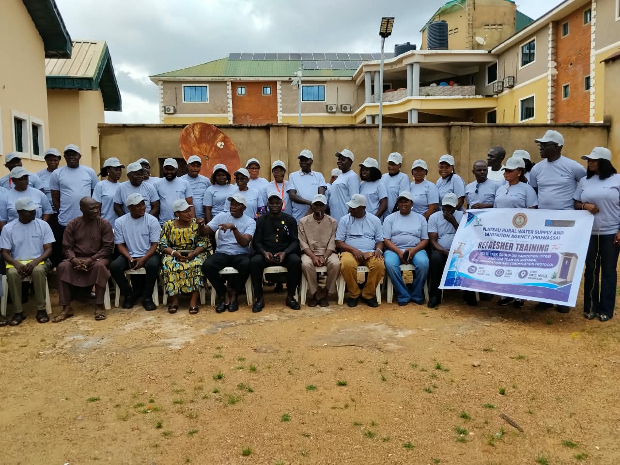 Participants poses for a group photograph during a PRUWASSA refresher training.